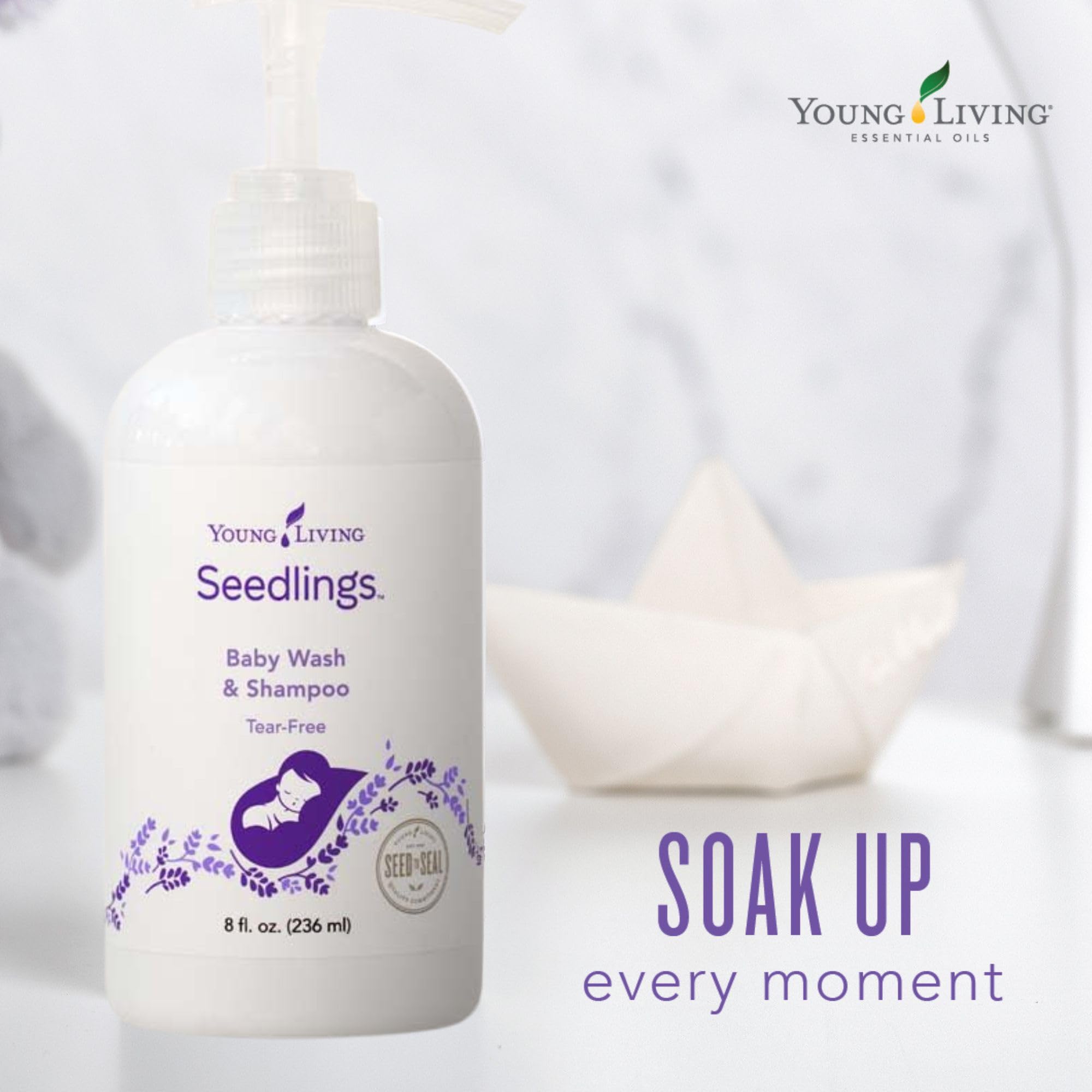 Young Living Seedlings bottle with baby-hair close-up, soothing tear-free formula for bath time.