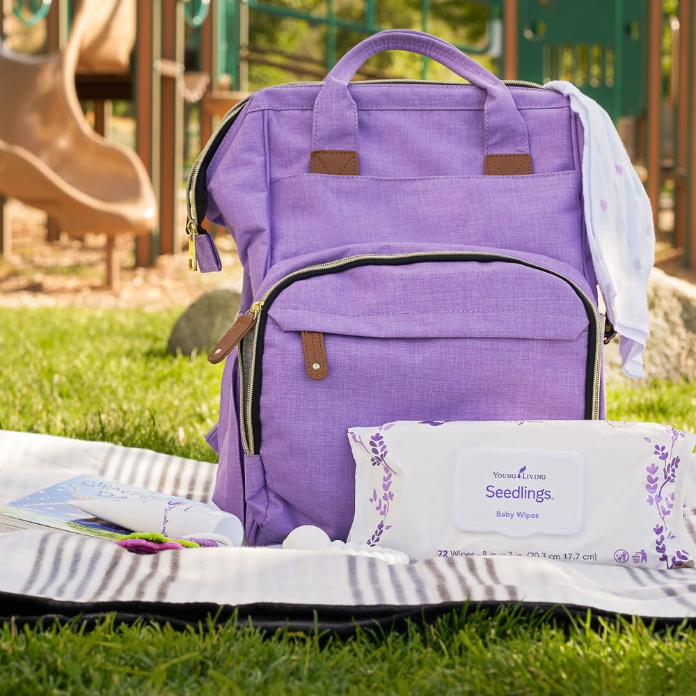 Hands-on use of Young Living Seedlings Baby Wipes for quick cleaning
