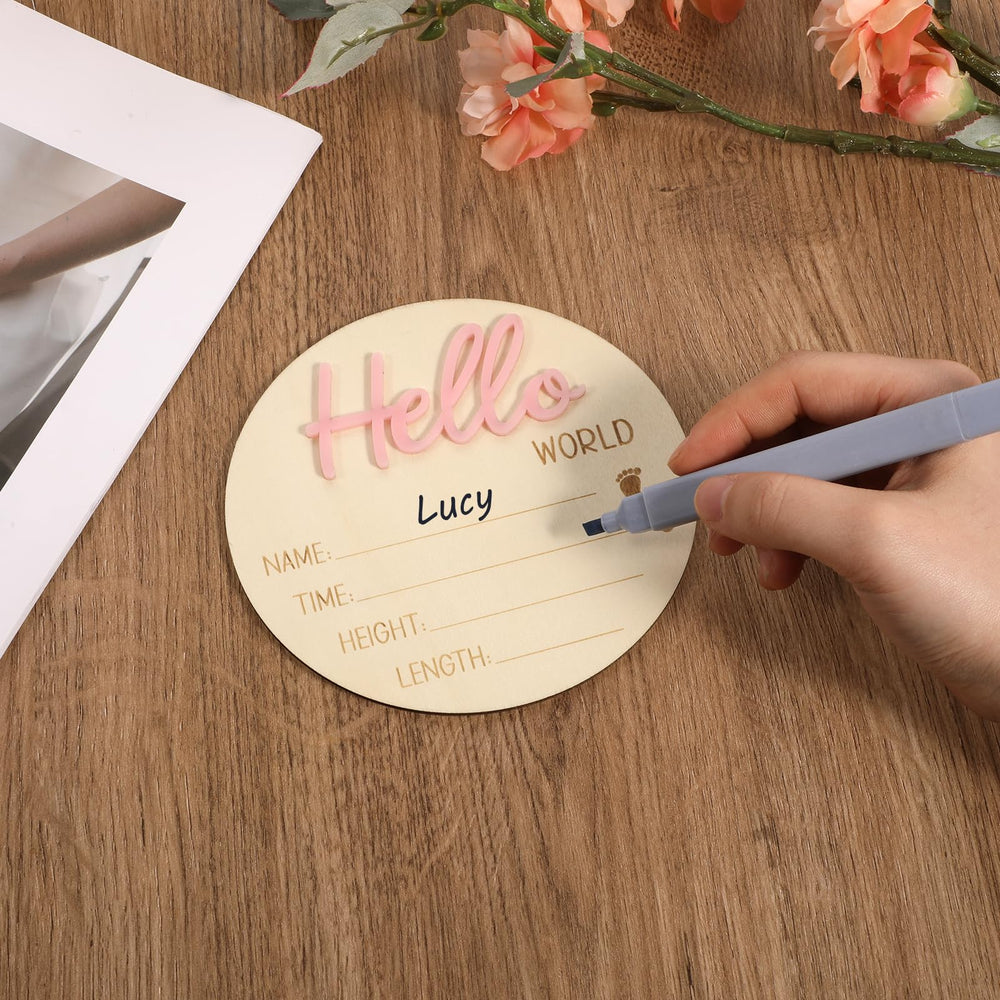 YQQYG nursery scene with the pink baby name sign as decor.