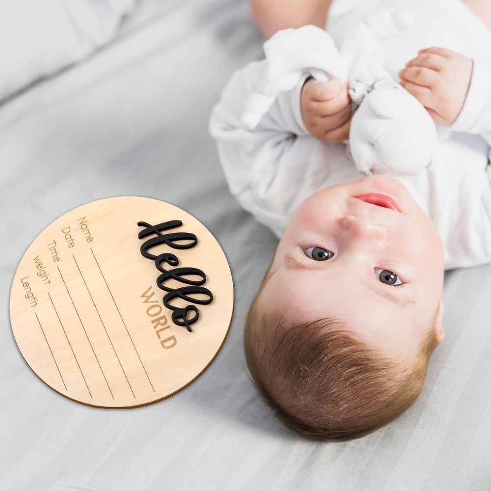 YQQYG circle-welcome-baby-sign brightens nursery while commemorating birth information.