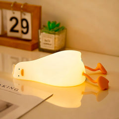 YR YRHH-PET existential crisis duck lamp on desk glowing warmly for cozy ambient lighting.