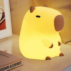 YuanDian Capybara Night Light warm glow and bottom button for adjustable brightness.