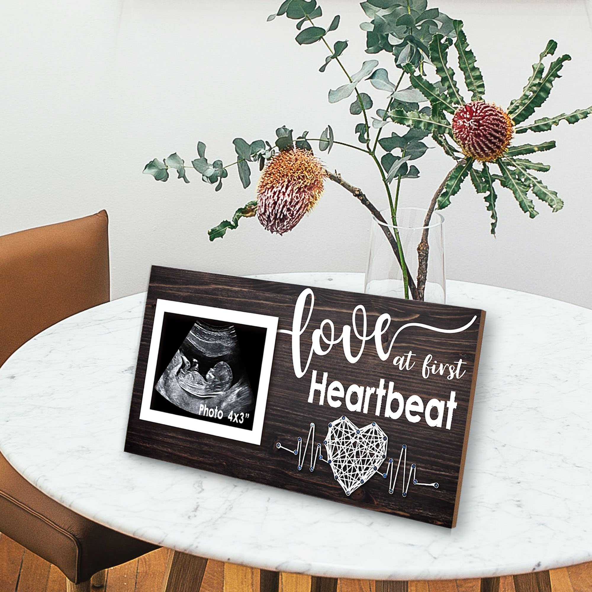 Yudarte heartbeat print frame enhances nursery decor.
