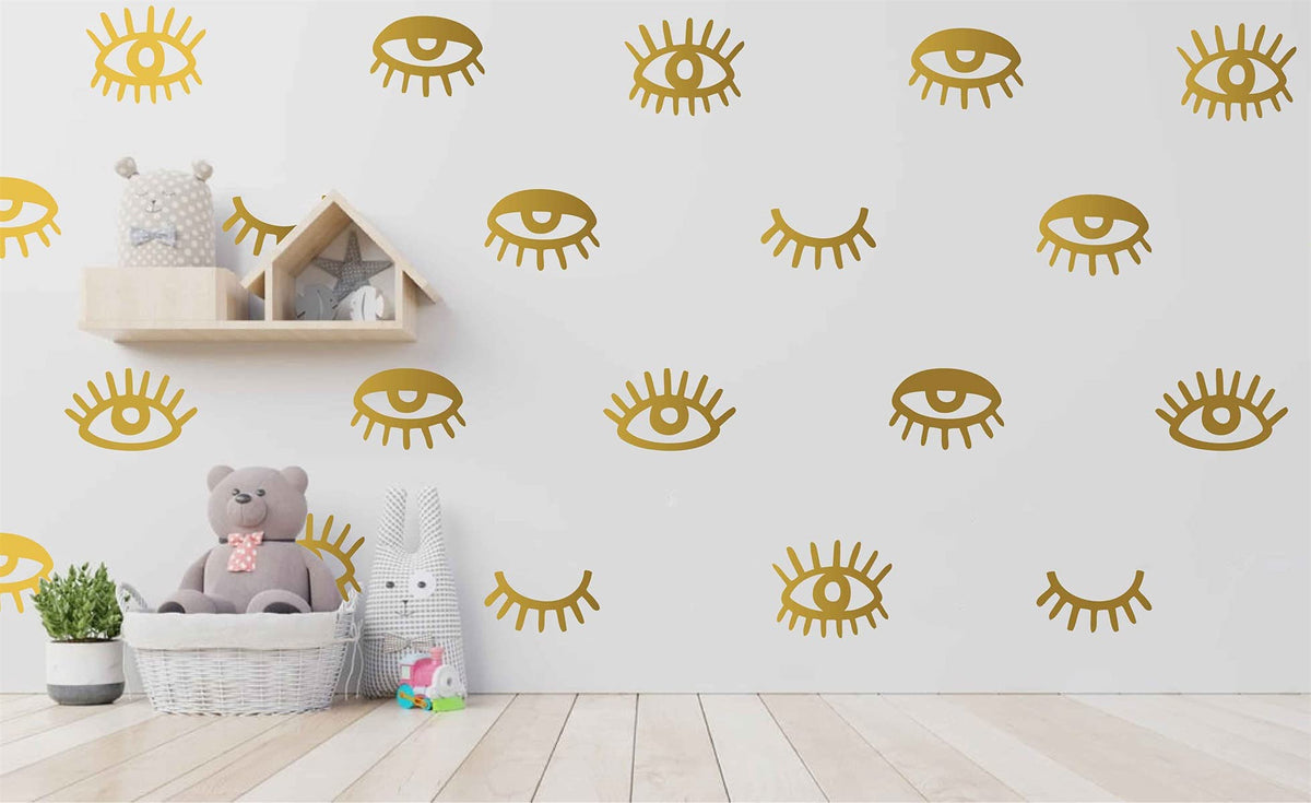 YUHASIDE 44pcs eye-pattern sticker gold pack enhances a playful girl’s bedroom wall decor.
