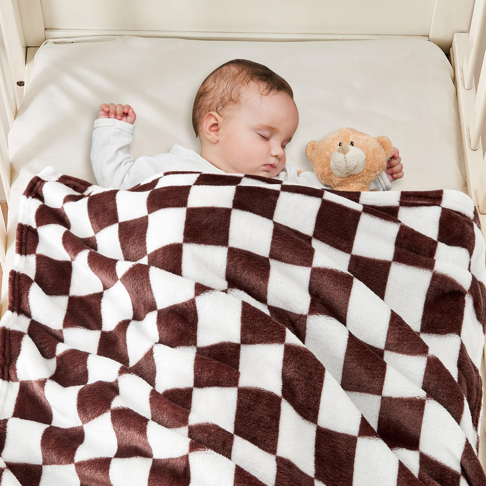 Yurhap baby blanket in stroller scene emphasizes travel-friendly warmth and easy care.