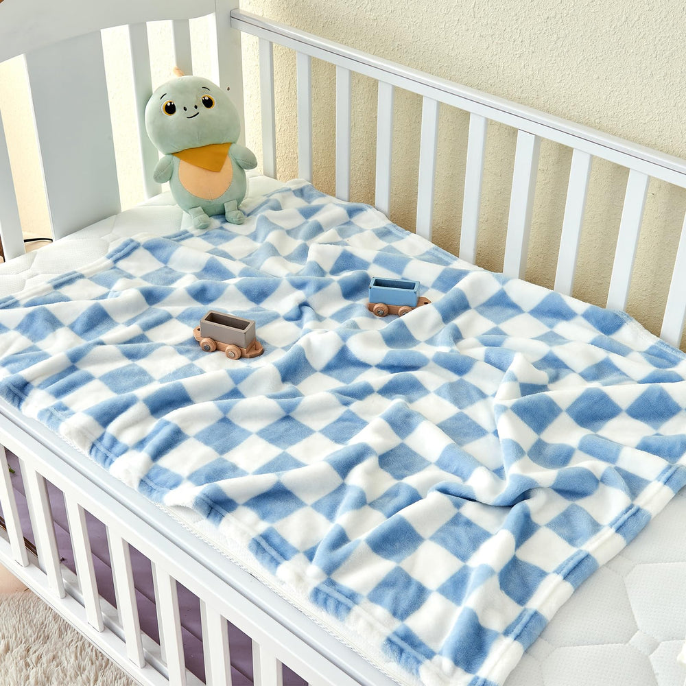 Yurhap checkered baby blanket blue in crib scene emphasizing warmth and breathable comfort.