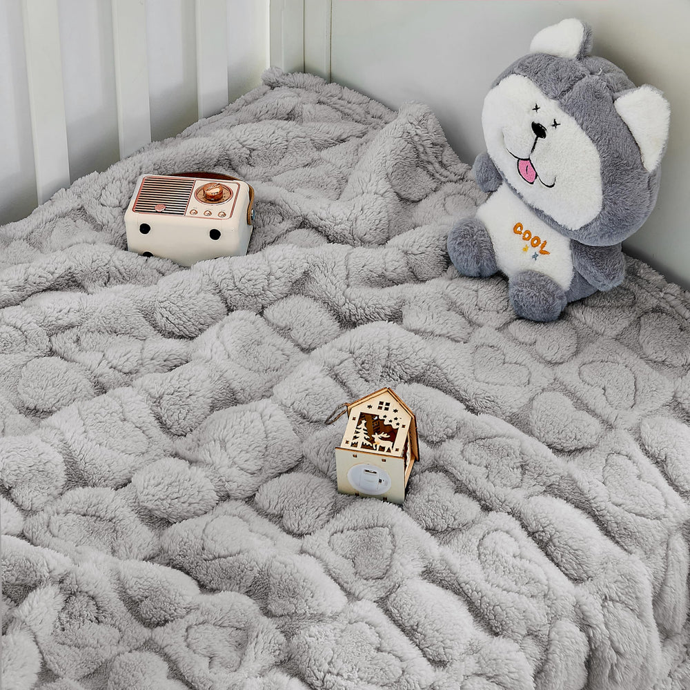 Decor-friendly design complements nursery with heart pattern.