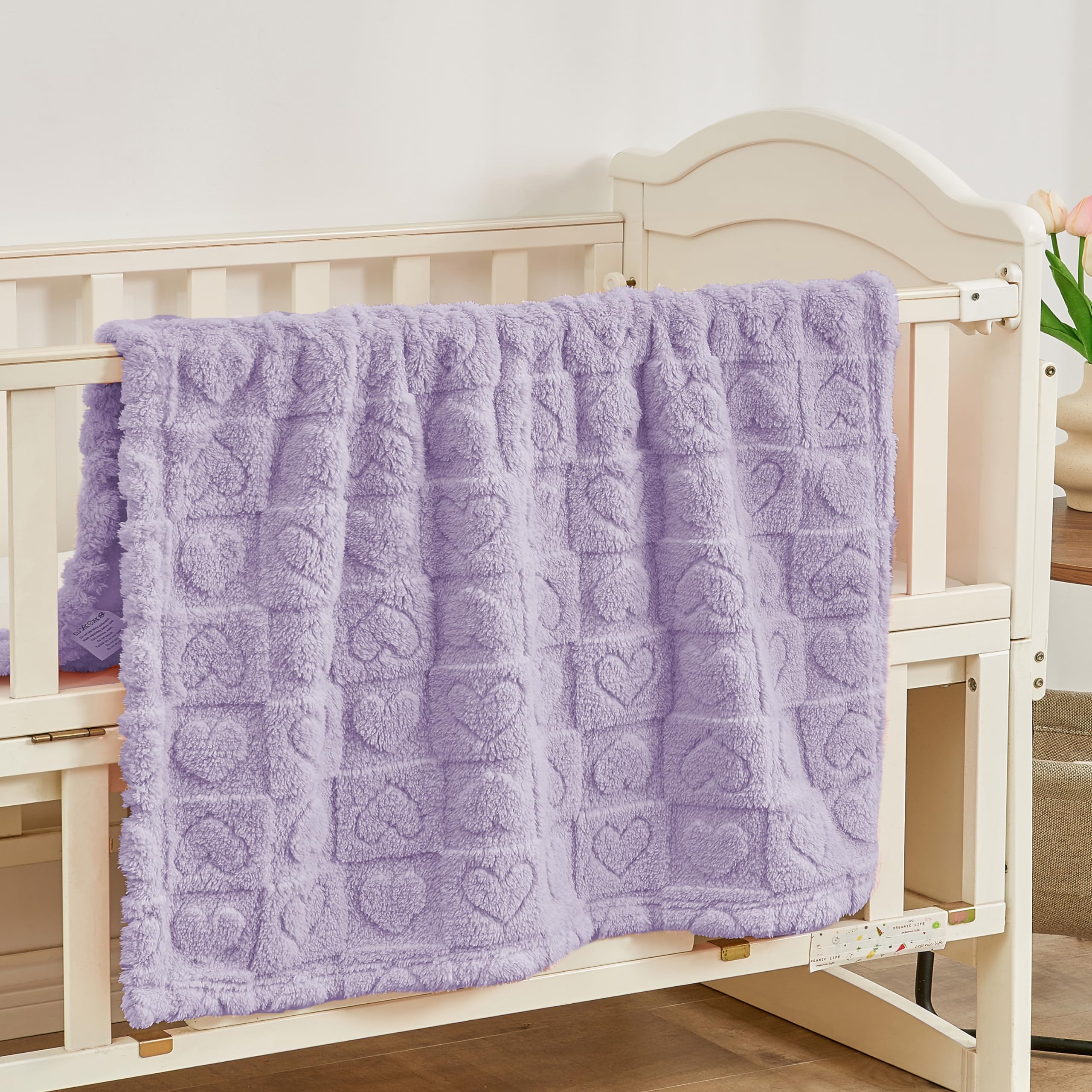 Yurhap fleece baby blanket purple on crib illustrating cozy sleep environment.