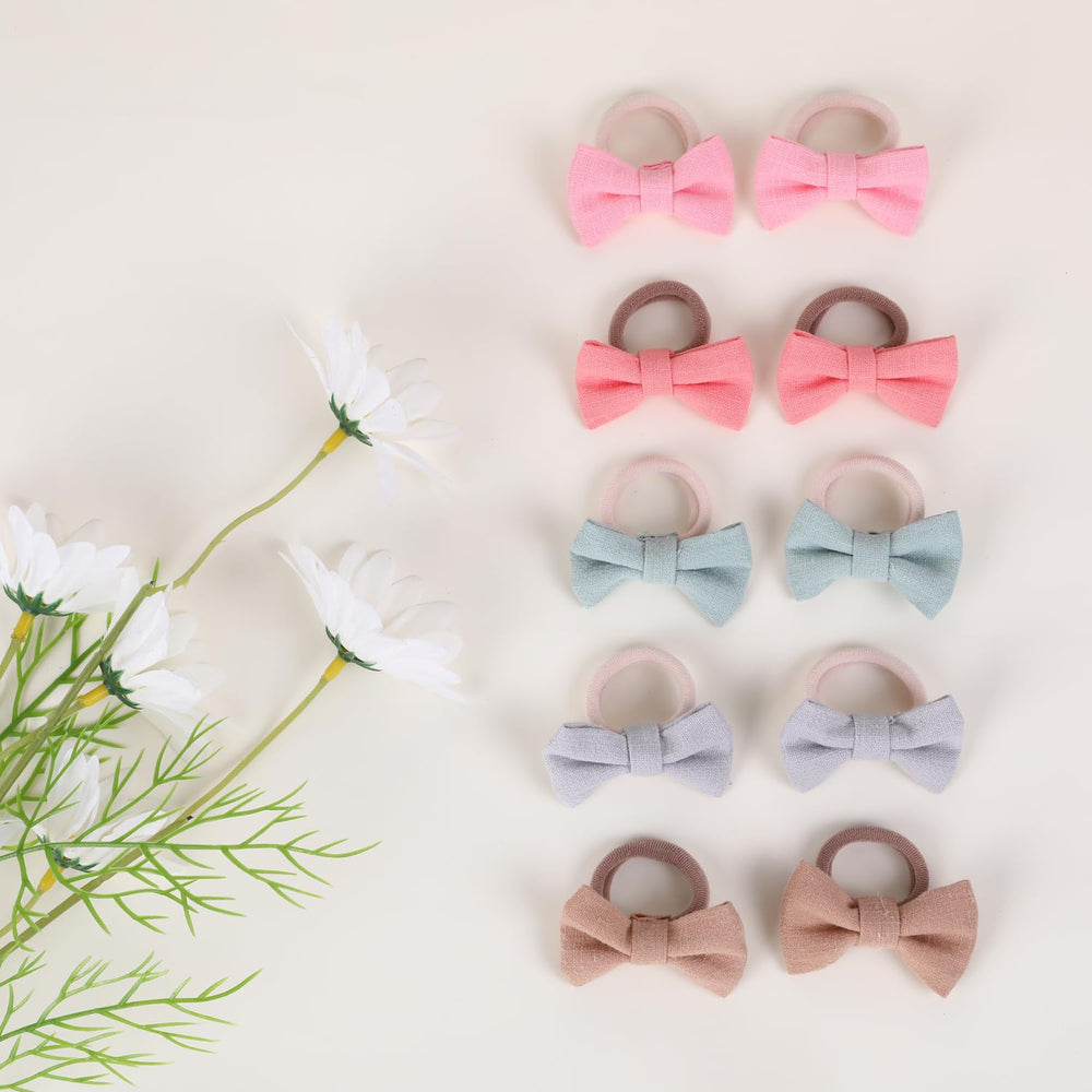 YWAOAIJD 2 inch linen bows worn by a toddler demonstrating cute, secure styling.
