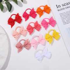 YWAOAIJD kids ponytail holders in action during play provide secure gentle grip.