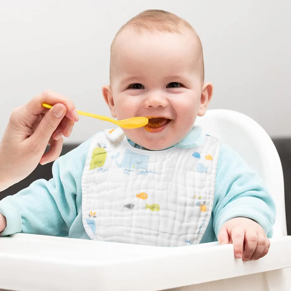 Zainpe six-layer bib features soft cotton muslin for gentle drool control.