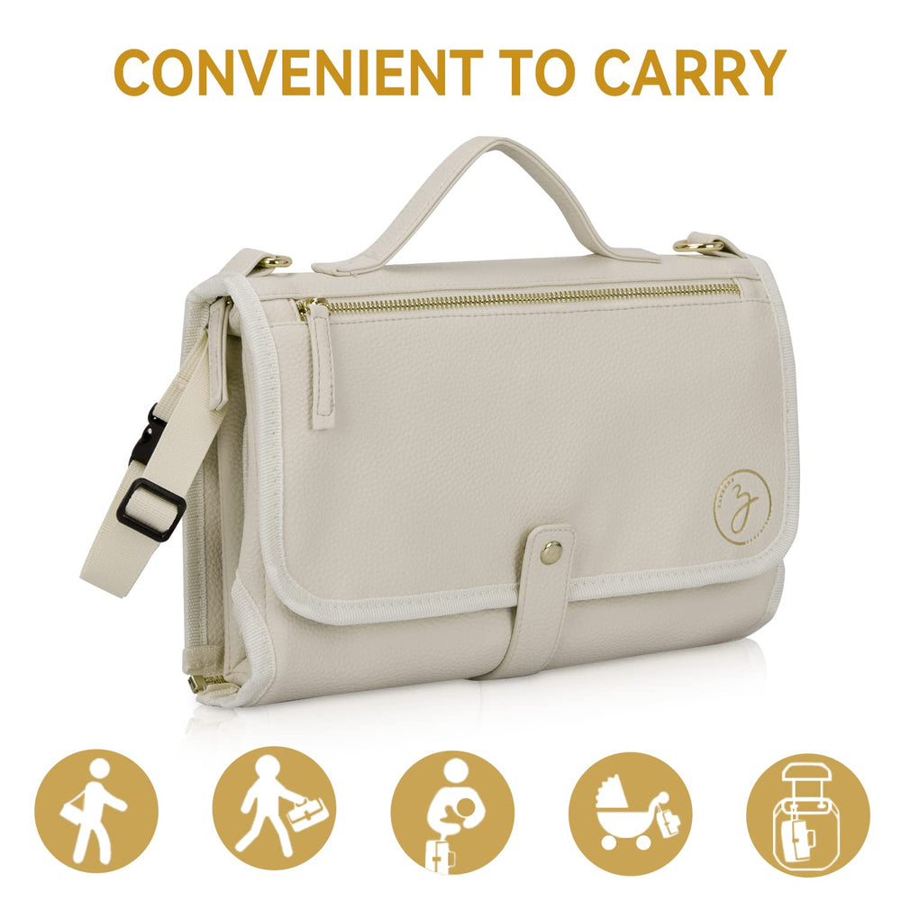 Zaveena cream changing pad compact in diaper bag for quick changes.