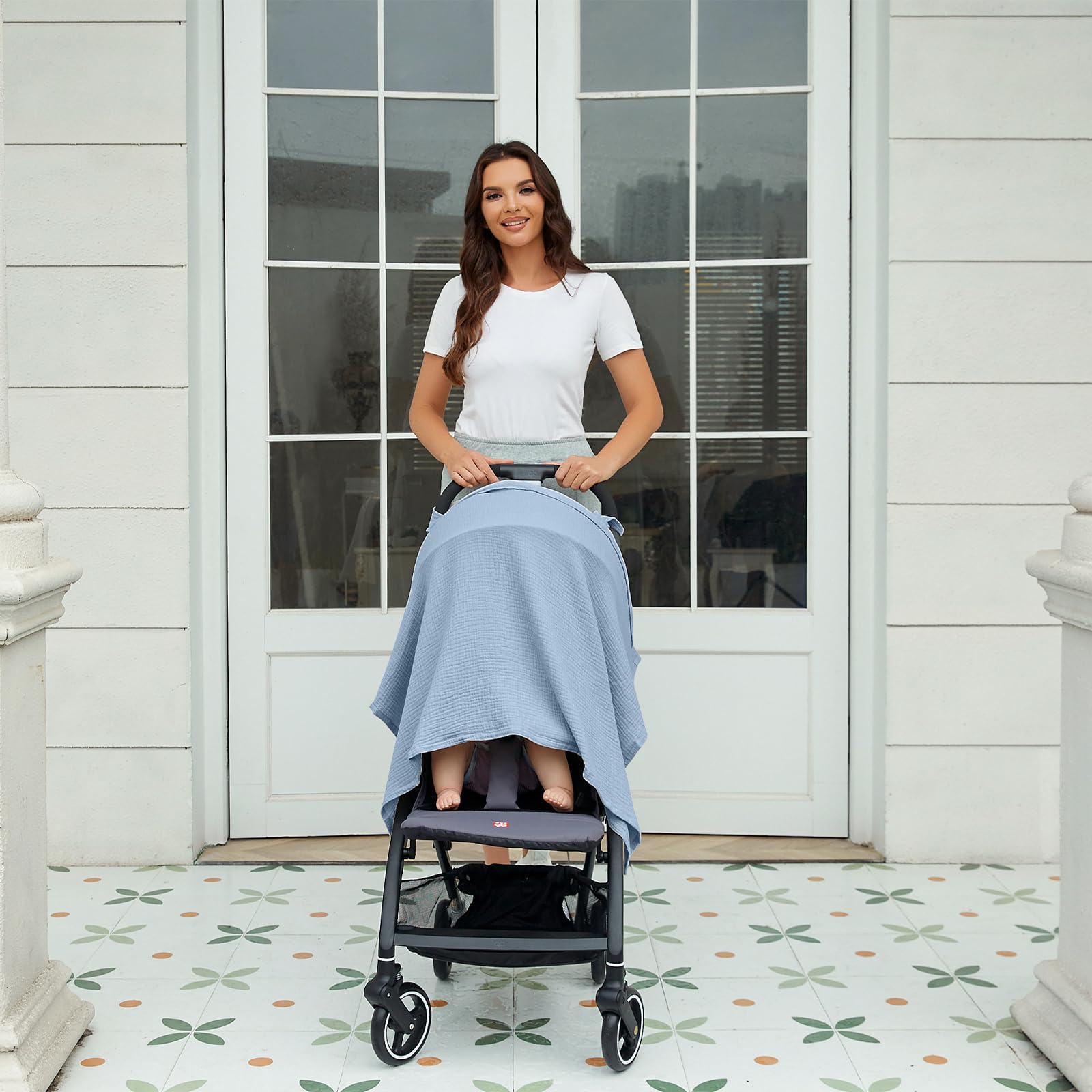Zdolmy Muslin Nursing Cover doubles as a stroller cover in light blue.