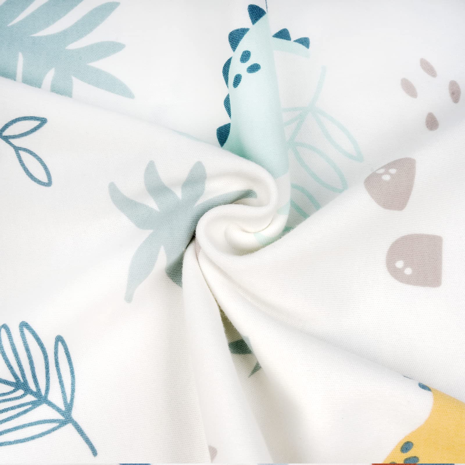 Zenssia dinosaur-print fabric brightens nursery and invites cozy bedtime routines.