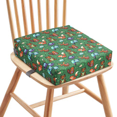 Zicac booster seat secured under and behind chair with straps for stability