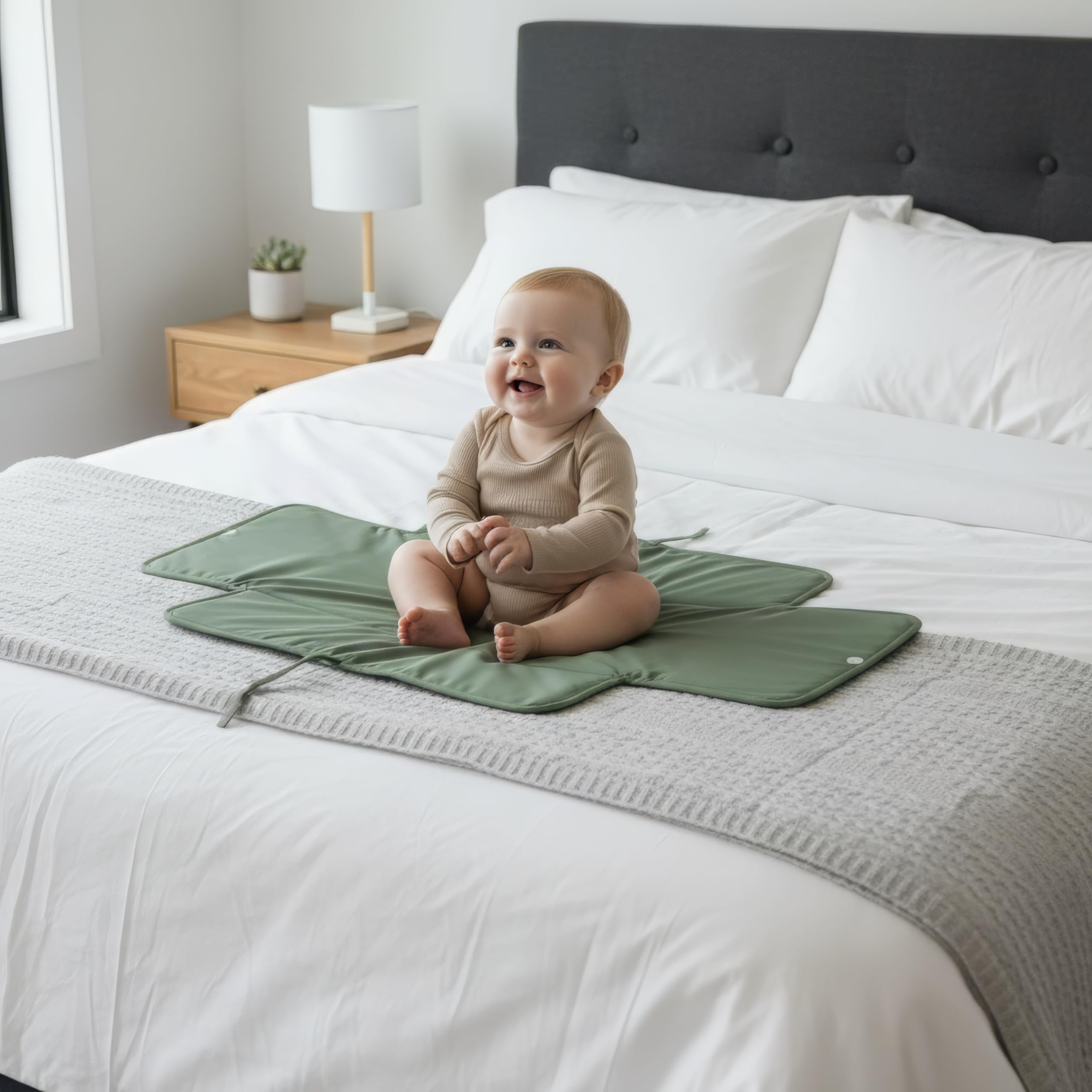 ZICOTO portable changing pad elastic-band secures snug storage in a diaper bag.