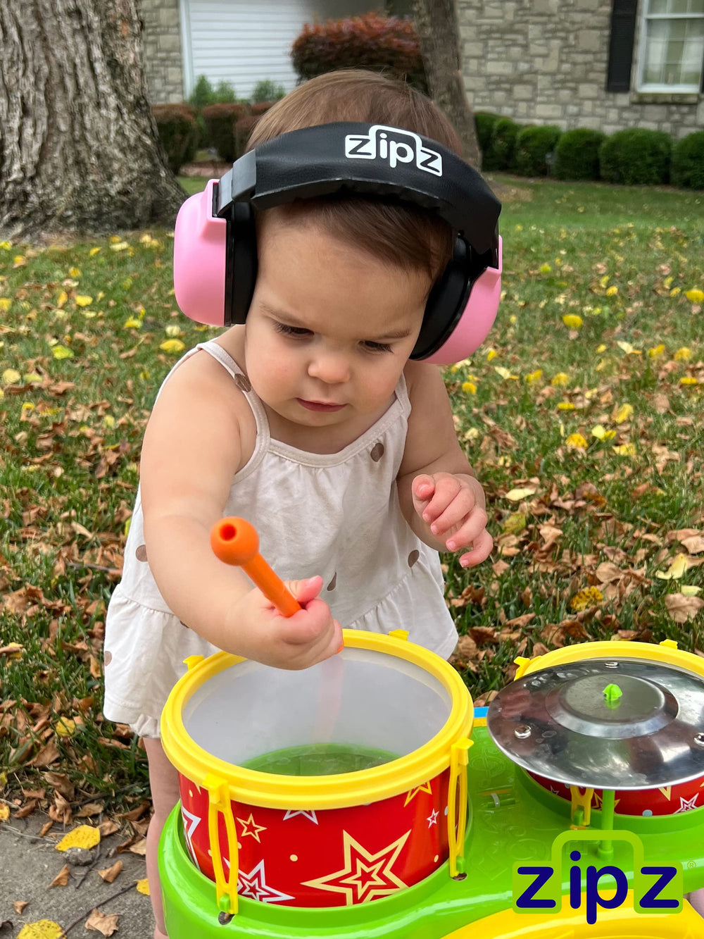 ZIPZ pink in-use concert image illustrates kid-friendly noise protection.