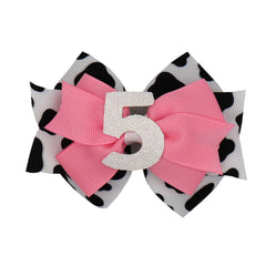 Zlwse birthday hair bow cow print front view, ideal for birthday outfits and photos.