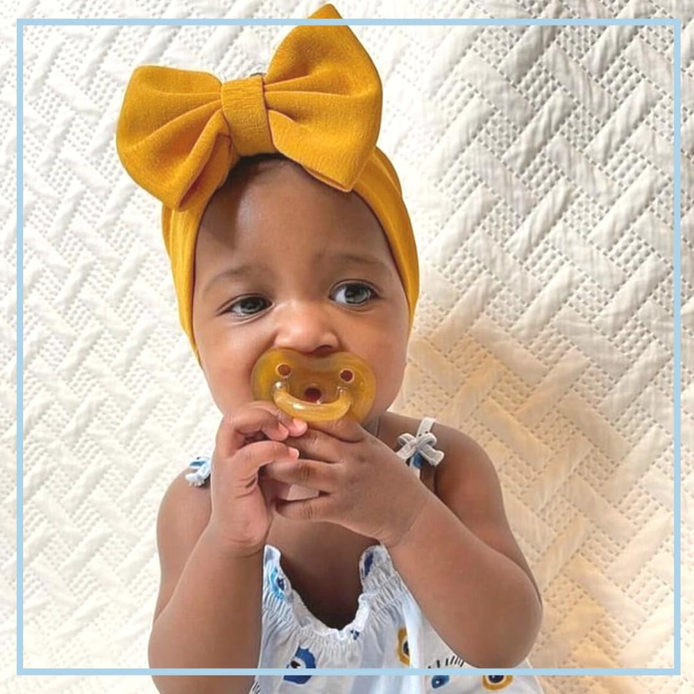 Zoë b Organic Simply Rubber Pacifier large heart-shape shield; side view shows easy-clean design.