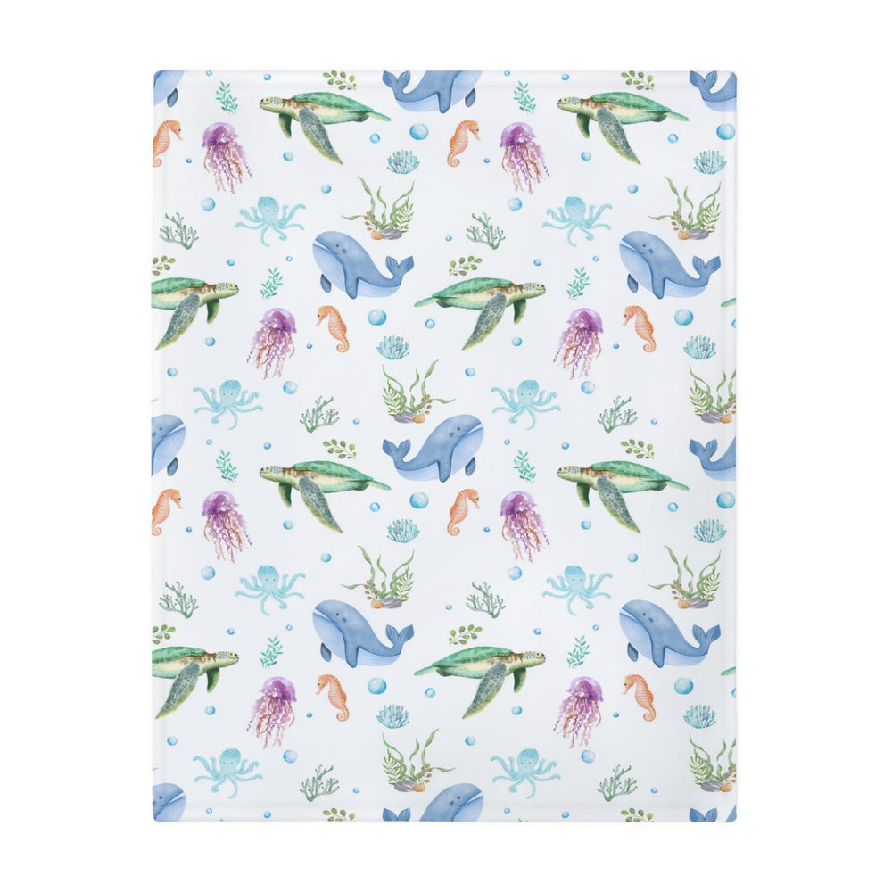 ZoUbqchY sea life baby blanket on crib scene with soft colors