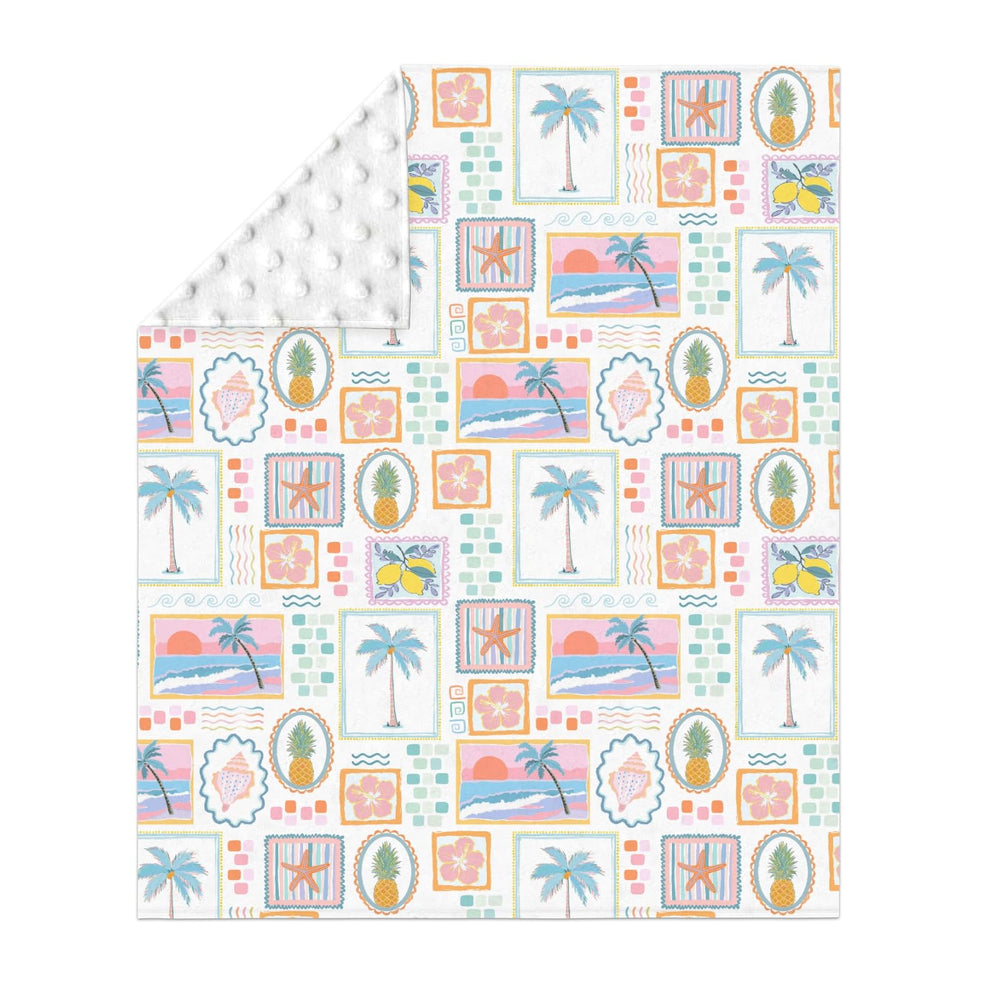 ZoUbqchY patchwork blanket back view showing dotted backing for gentle soothing texture.