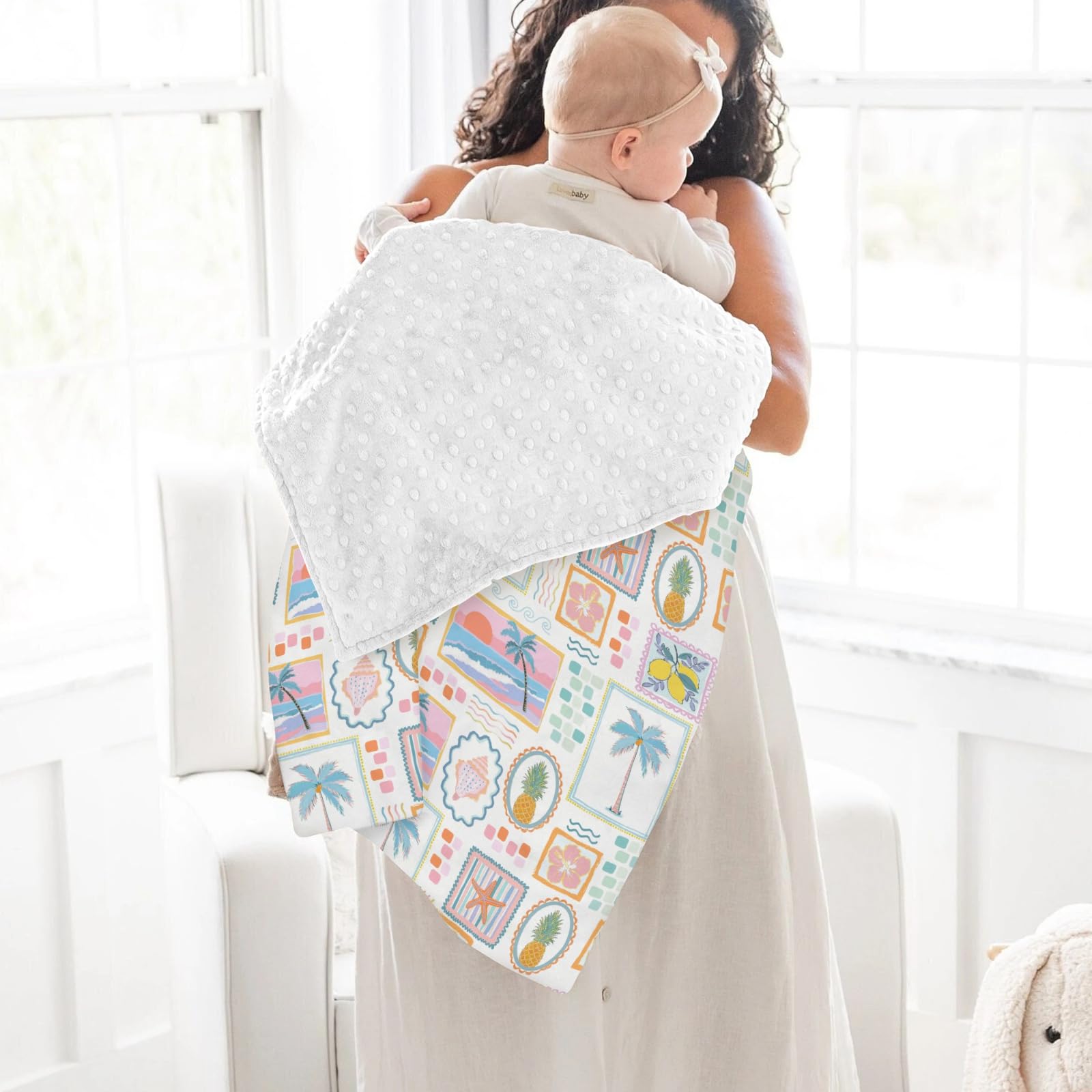 ZoUbqchY baby blanket draped over crib showcasing gender-neutral design.