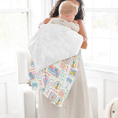 ZoUbqchY baby blanket draped over crib showcasing gender-neutral design.
