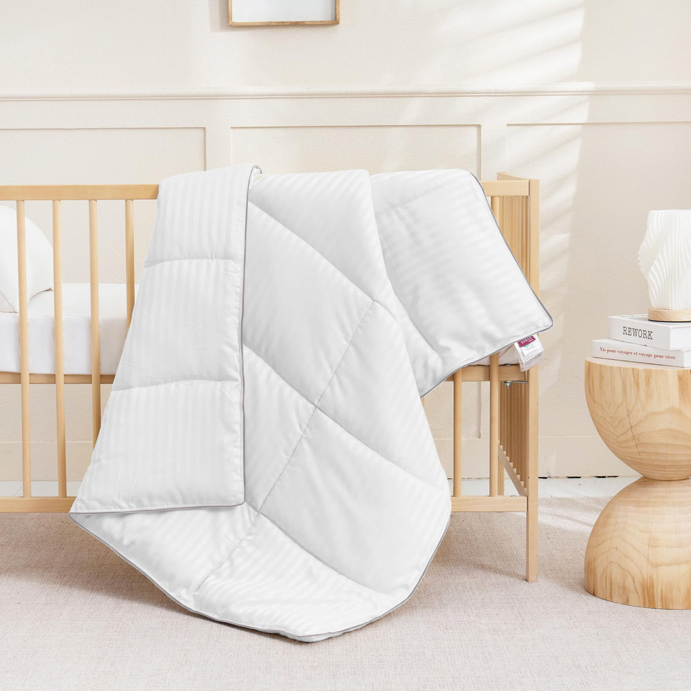 ZPECC Toddler Down Alternative Comforter white stripe design complements nursery or daycare decor.