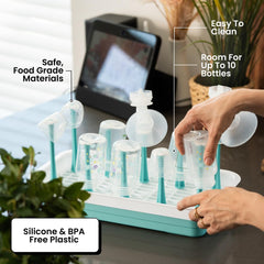 Zunee bottle parts compartment shows dedicated nipples and parts storage for easy assembly and air-drying.