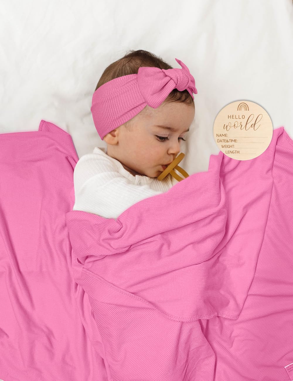 ZURLEFY baby hat in hot pink pairs with swaddle for gentle warmth.
