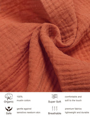 ZURLEFY Rust pack and play sheets on mattress demonstrating snug elastic edge fit for security.