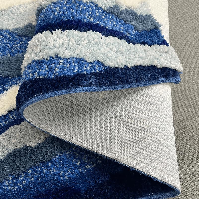 ZYLG blue 3D ocean wave bath mat demonstrates quick water absorption to keep floors dry.