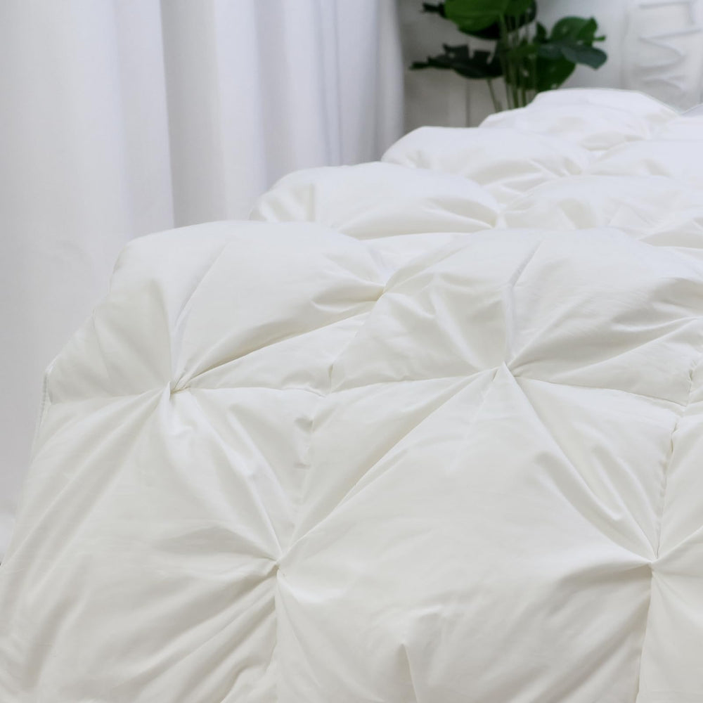 zzlamb box-construction down blanket ensures even fill distribution for consistent warmth.